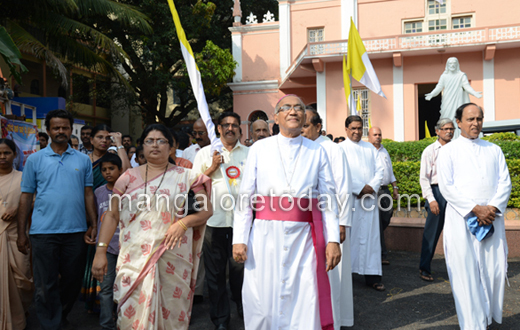 vehicle rally carrying the  statue of Pope John Paul II